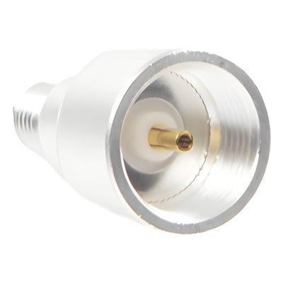 Adaptador UNIDAPT Hembra a SMA Hembra Inverso. Plata / Oro / Teflón.
